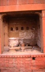 A large, nameless tirtha containing a number of different linga. A symbol of the energy and power of Shiva, the linga is set in a conical base known as a yoni, a female symbol. The empty niches on the wall once contained icons long since disappeared