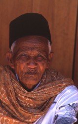 Torajan man in Rontepao. His circular black hat is typical of those who consider themselves of Bugi origin